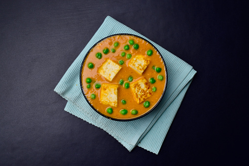 Cottage cheese and peas curry top view, matar paneer