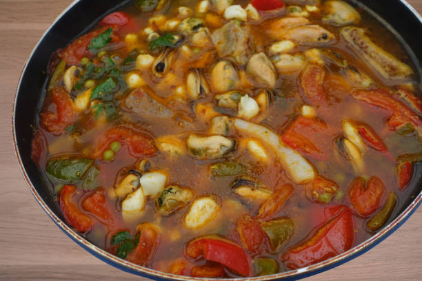 istock Broth with various seafood and vegetables for cooking rice 1506901444