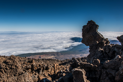 Beautiful aerial view of volcano caldera from summit Pico del Teide mountain. Lava rocks and volcanic Mars landscape in El Teide National park. Main landmark on Tenerife, Canary Islands, Spain. High quality photo