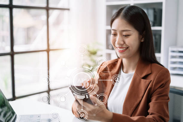 istock Modern technology and networking concept, woman using laptop, tablet and smartphone with virtual screen API icon Software development tool. API Application Programming Interface. 1506928135