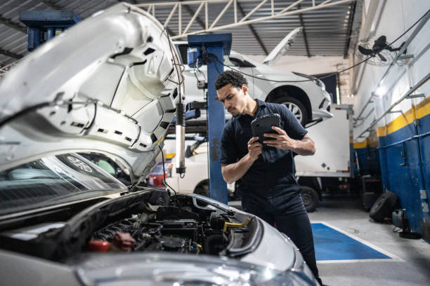 istock Mechanic using the digital tablet at an auto repair shop 1506946664