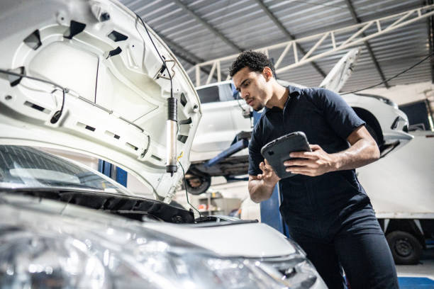 istock Mechanic using the digital tablet at an auto repair shop 1506946693