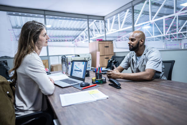 Manager talking to employee in the office
