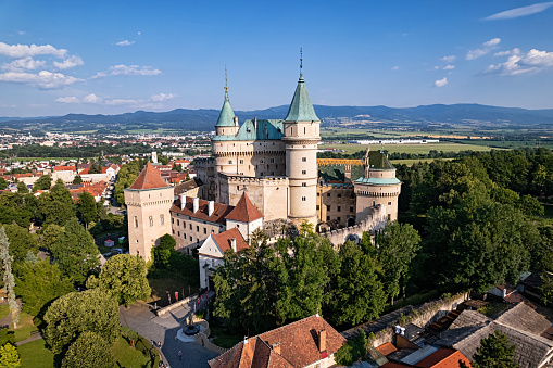 Bojnice, Slovakia: Famous Bojnice Castle in Bojnice, Slovakia. Aerial panorama at clear summer day.