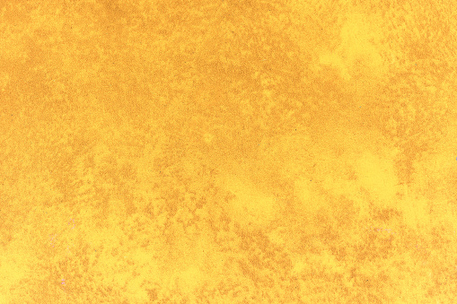 Mottled bright ornage background texture