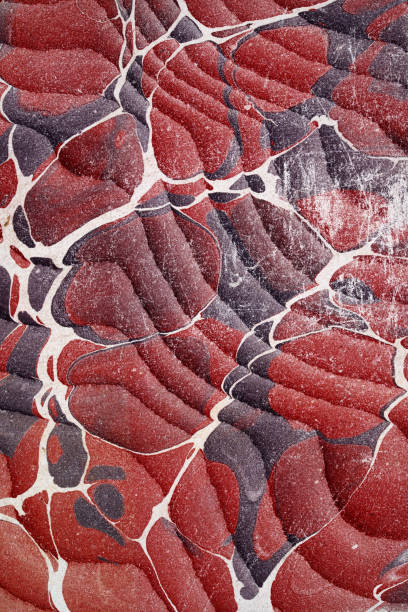 Scuffed red and purple marbled vintage paper pattern background