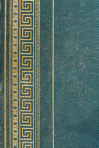 Vintage Greek key pattern, meander or meandros decorative border, in gold on turquoise