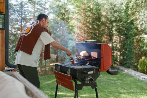 istock Man cooking on bbq grill, weekend activities at the backyard 1507000585