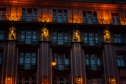 Vienna, Austria - April 2019: Lit statues on stadtpalais Todesco by night.