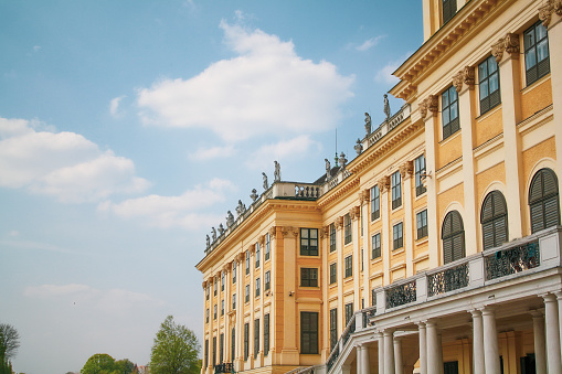 Vienna, Austria - October 06, 2021: Magnificent cascading fountains and sumptuous marble antique statues in the park of the Belvedere Palace in Vienna, the capital of Austria. Autumn rainy weather in Europe. Popular tourist and historical attraction, baroque architecture