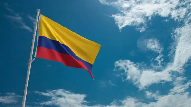 Photo of Colombian flag waving texture pattern blue cloudy sky background wallpaper copy space independence columbian country national freedom holiday patriotic happy celebration festival holiday history event