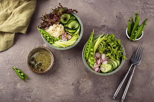 Vegan healthy green buddha bowl with peas, cocumber, salad and zucchini