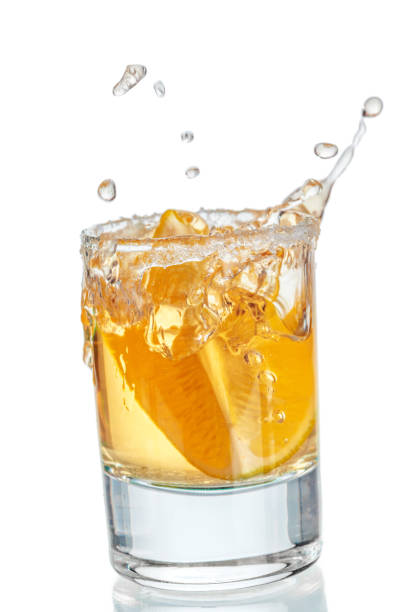 istock Gold tequila shot isolated on white background 1507022999