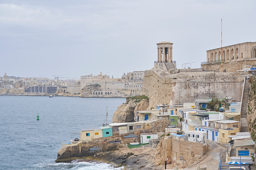 Valetta, Malta -  June 6, 2023: Small fishing village along the edge of the Grand Harbour in Valetta, Malta