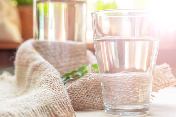 istock Glass of pure water on kitchen table 1507042595