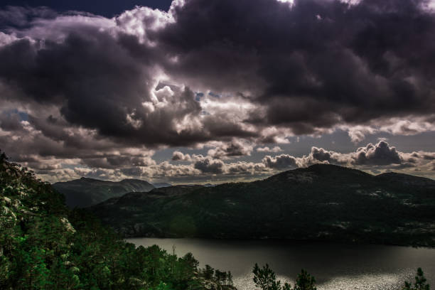 istock Norway landscapes. Lake, mountains on background and cloudy sky 1507043151