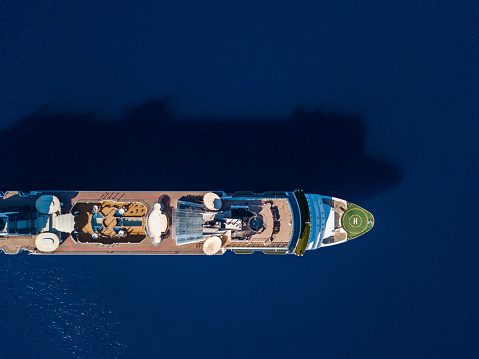 Top view from drone on luxury cruise ship in the blue sea