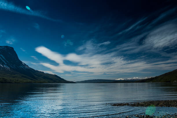 istock Norway landscapes. Lake, mountains on background and cloudy sky 1507048268