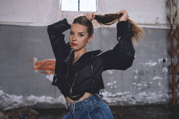 Beautiful young woman with leather jacket.