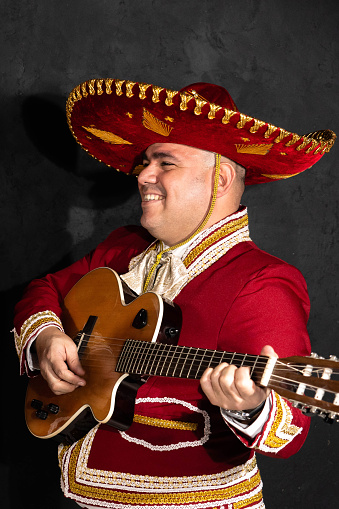 Mexican mariachi musician on a black background