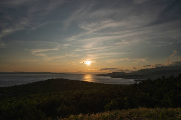 Atmospheric sunset over the Croatian Adriatic coast in early summer.