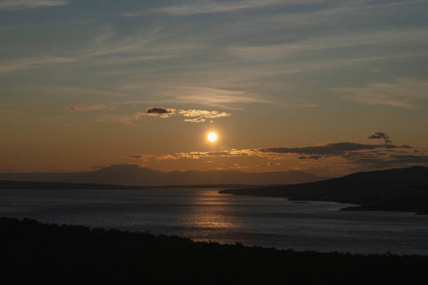Atmospheric sunset over the Croatian Adriatic coast in early summer.