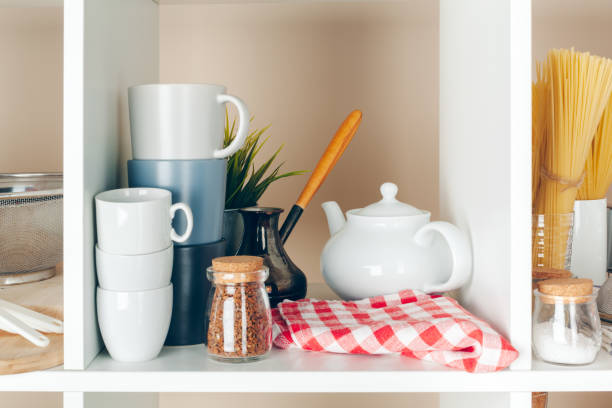 istock Utensils and mugs, Kitchenware on wooden shelves 1507068020