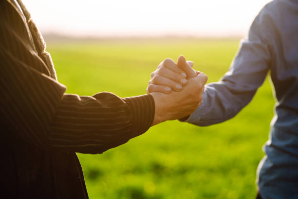 istock Two farmers shake hands 1507131172