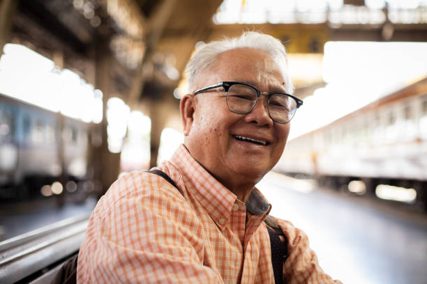 istock Senior man sitting on railway station and waiting for train 1507165028