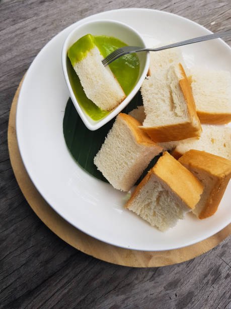 Dipping Toast in Pandanus Custard