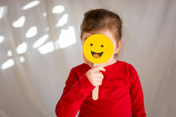 istock Girl holding smiley face 1507173235