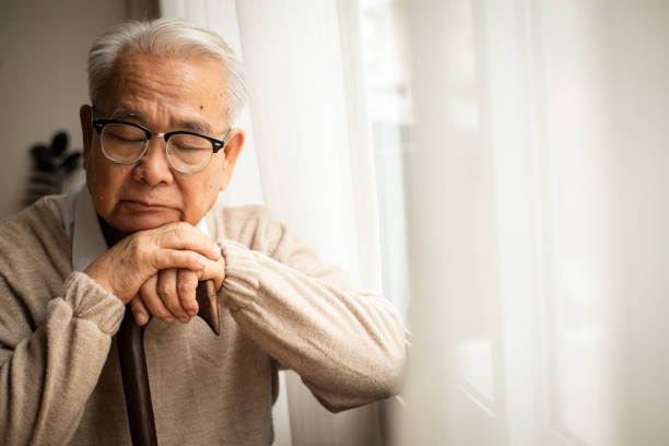 istock Satisfied old man tired and nostalgic while sitting near the window. 1507213004