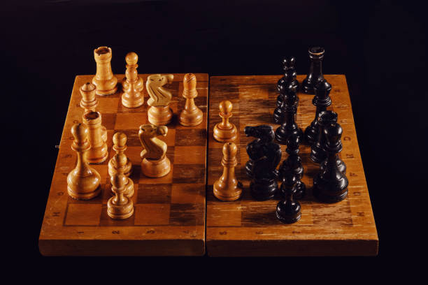 istock Playing with old chess pieces in the middlegame. Chess board with retro pieces 1507217469