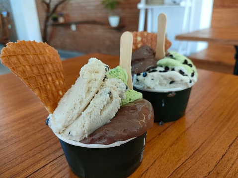 Gelato ice cream is one of the most popular snacks for all people. gelato ice cream is liked by children to parents. you can see gelato ice cream in a paper bowl that looks delicious. Ice cream flavors have a variety of flavors.