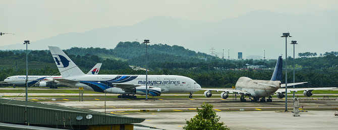 Kuala Lumpur, Malaysia - May 4, 2018. Passenger airplanes docking at Kuala Lumpur International Airport (KLIA).