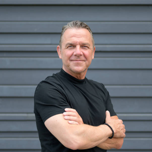 istock Man looking sternly straight ahead with arms crossed 1507218605