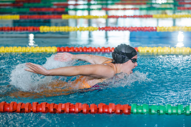 istock Female swimmer moving through the water performs a butterfly stroke 1507218723