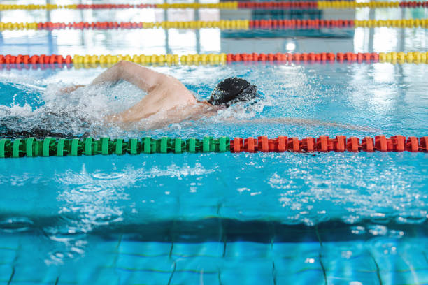 istock Professional male swimmer swimming the front crawl style 1507218743