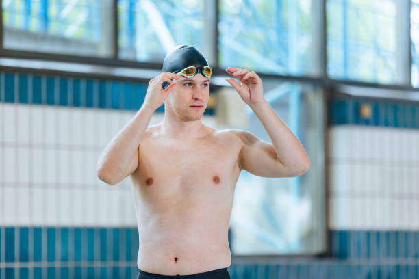 istock Swimmer looking at a pool focusing on the race with goggles 1507219904