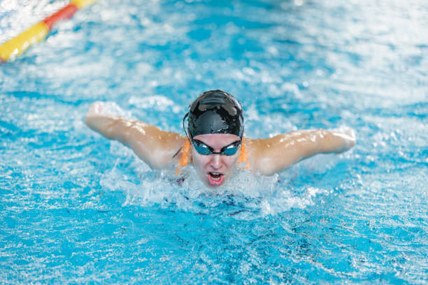 istock Female swimmer moving through the water performs a butterfly stroke 1507220114