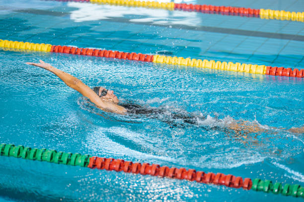 istock Female athlete swimming backstroke in the pool 1507220336