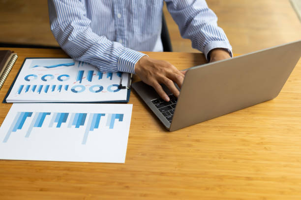 istock Businessman working with laptop and analyzing charts on financial documents with calculator. 1507221047