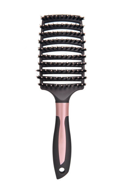 istock A bristled pink hair brush against a white background 1507227388