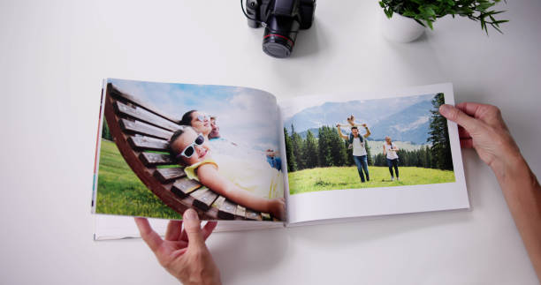 Woman Looking At Photo Album stock photo