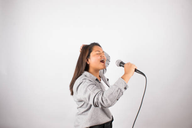 istock Latin woman singing passionately with a microphone. 1507231543