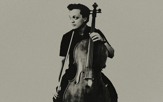 Portrait of a young cellist at the concert.