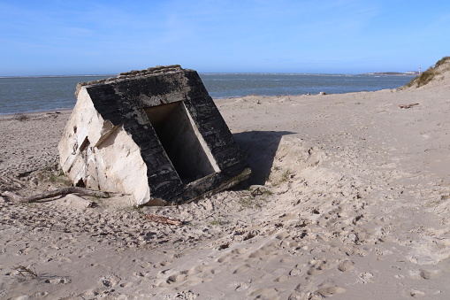 Bunker ruins of Juno Beach with sand dune and grass on a sunny summer day, Courseulles sur Mer, Normandy, France