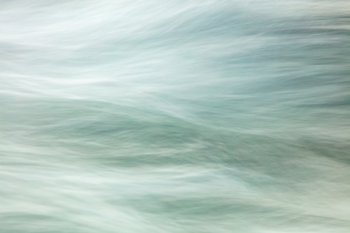 A slow shutter speed was used to capture the intricate swirls of shallow coastal waters as they ebb and flow onto the shore