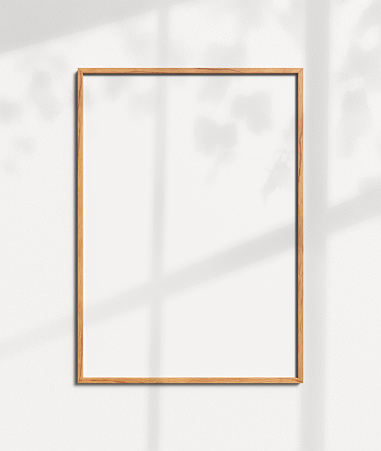 Empty wood photo frame template on white wall