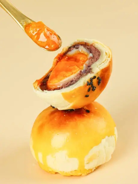 Egg-Yolk Puff, made from wheat and duck eggs and butter, traditional Chinese pastry, mooncakes filled with egg yolk